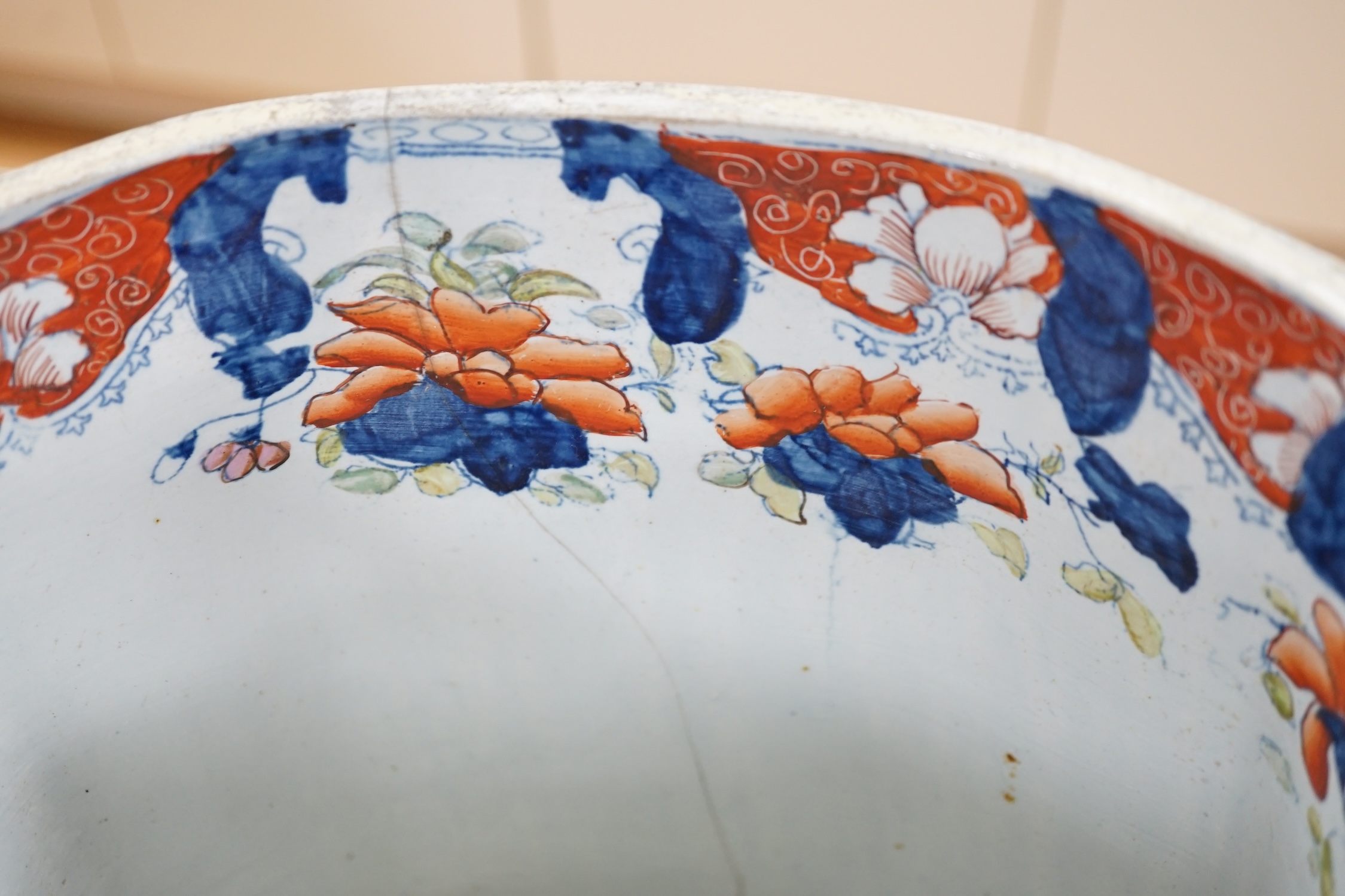 Seventeen ironstone items including two jardinières, a tureen and a quantity of plates, largest 28cm high. Condition - poor to fair